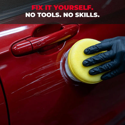 Hand using sponge to remove scratches on red car door with visible paint marks